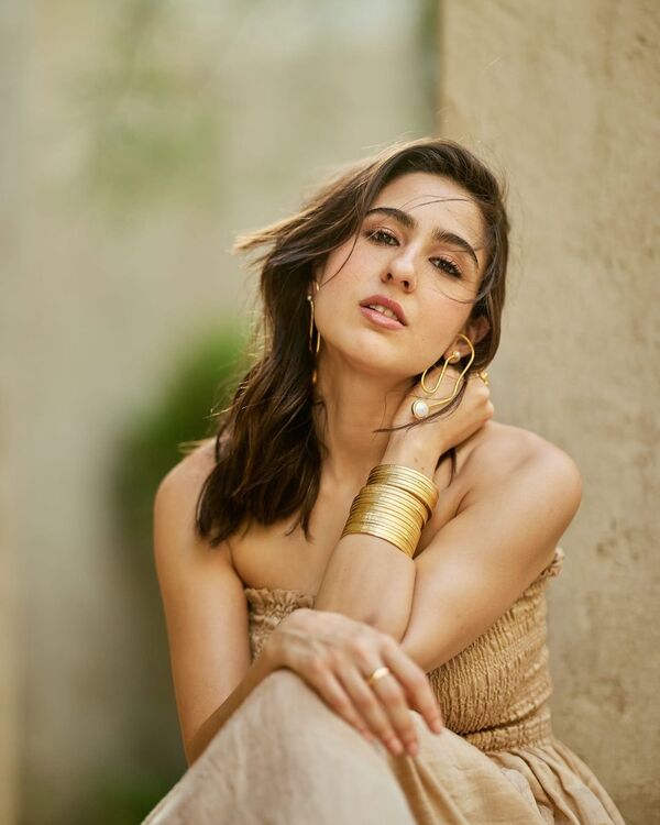 Sara Ali Khan slays in a beige strapless dress & graceful skirt, paired  with gold bangles & earrings - Bollywood.com